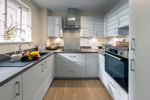 a kitchen with white cabinets