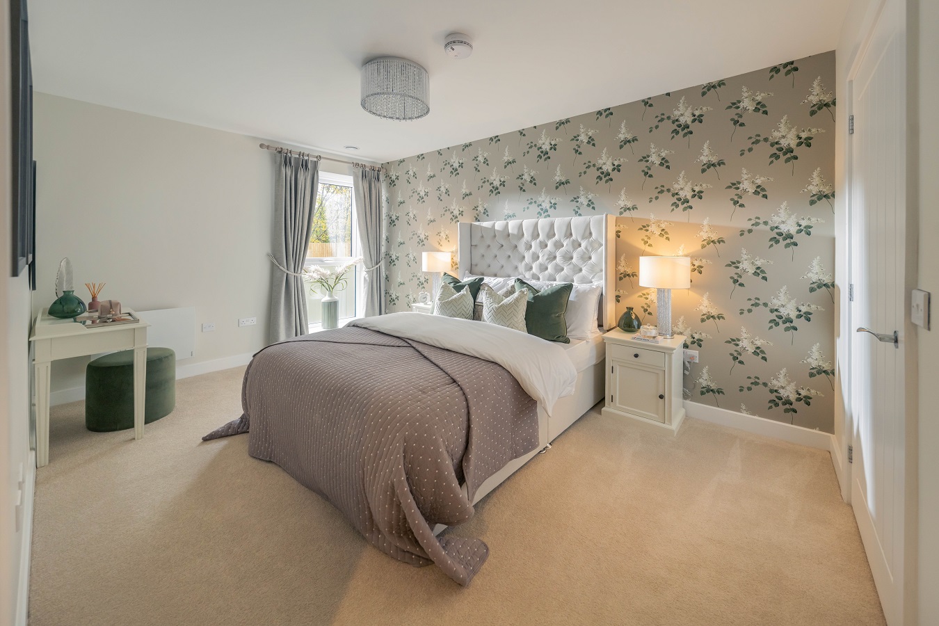 a bedroom with a bed and a lamp