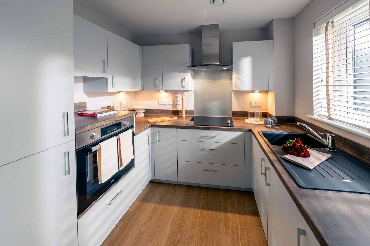 a kitchen with white cabinets