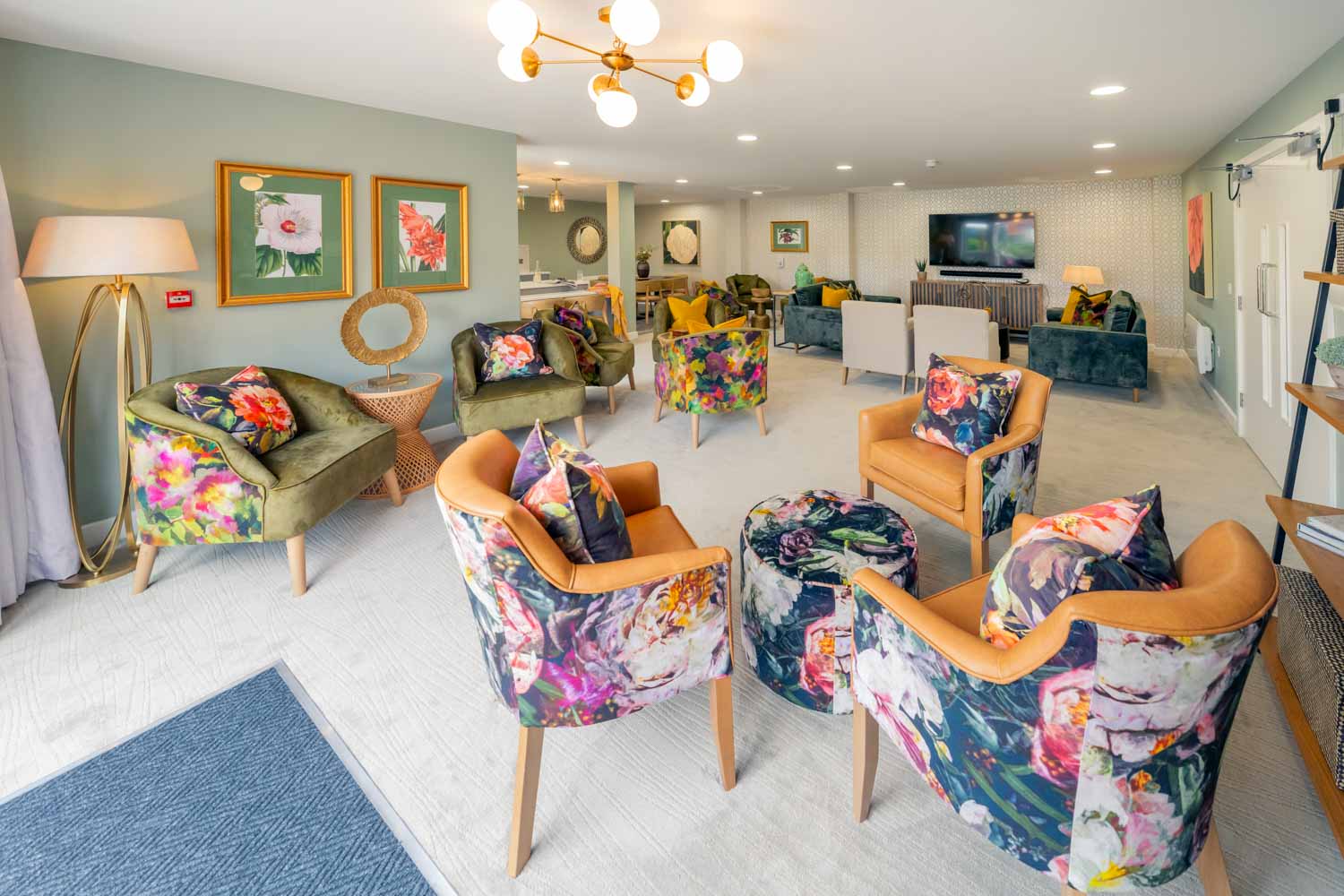 a living room with a couch and chairs