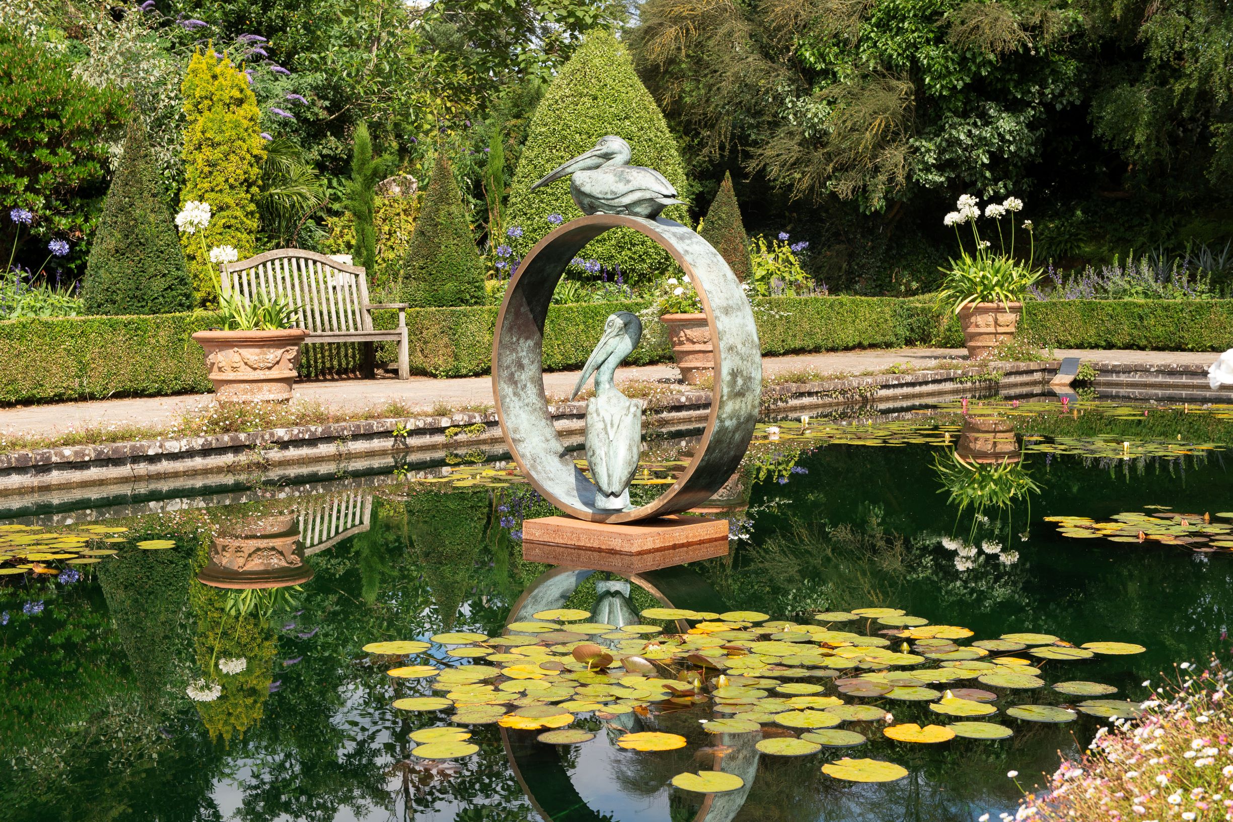 a sculpture in a pond