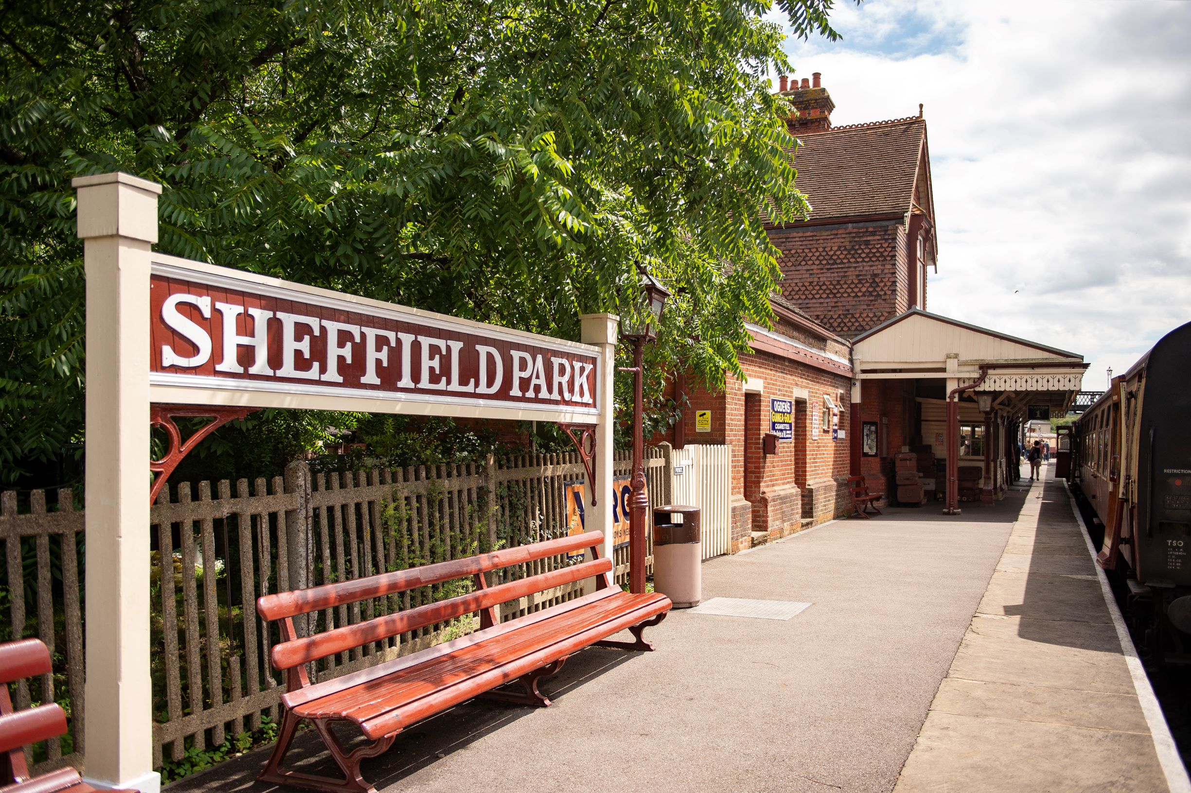 a train station with a bench