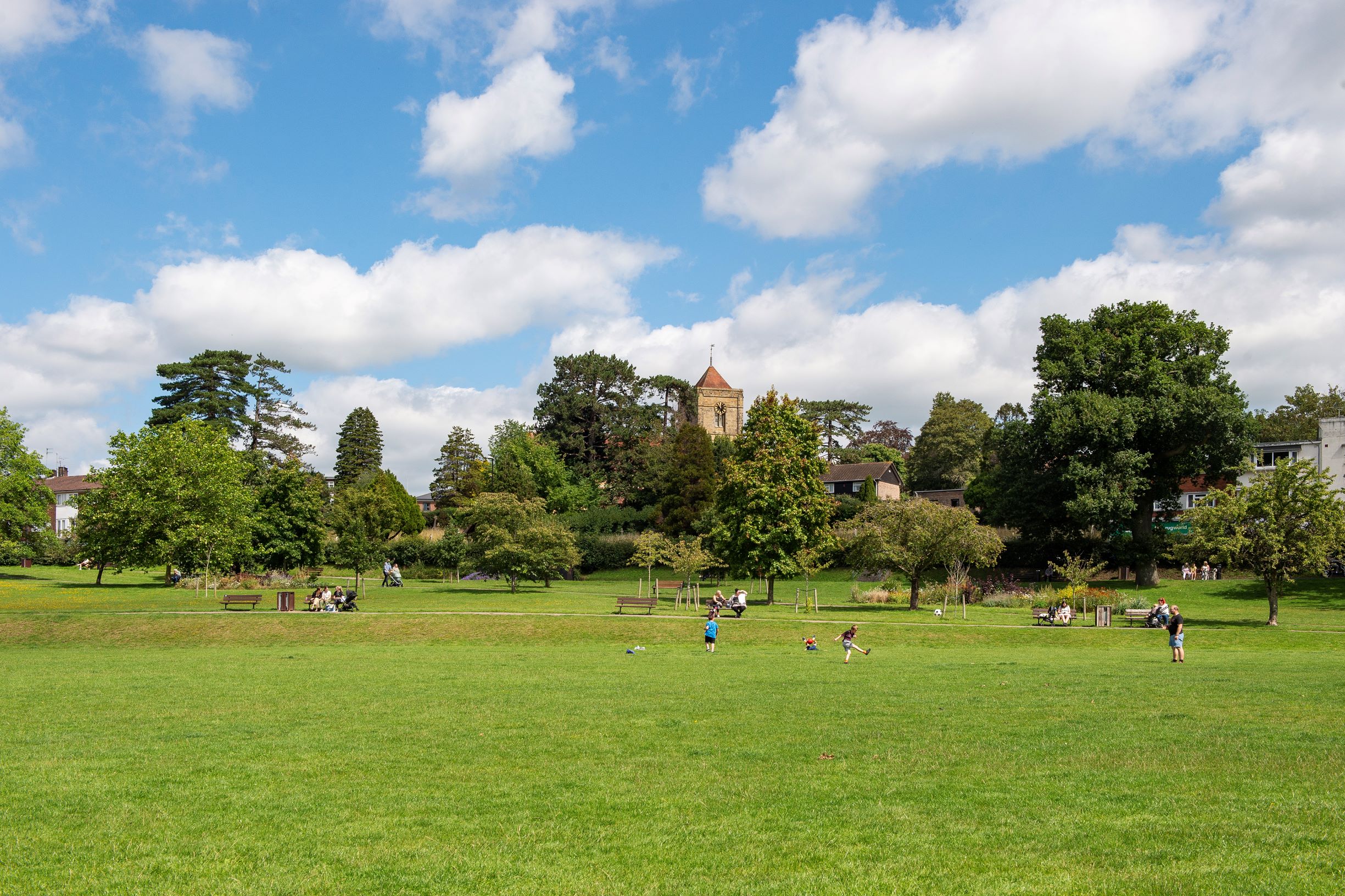 a group of people playing in a park