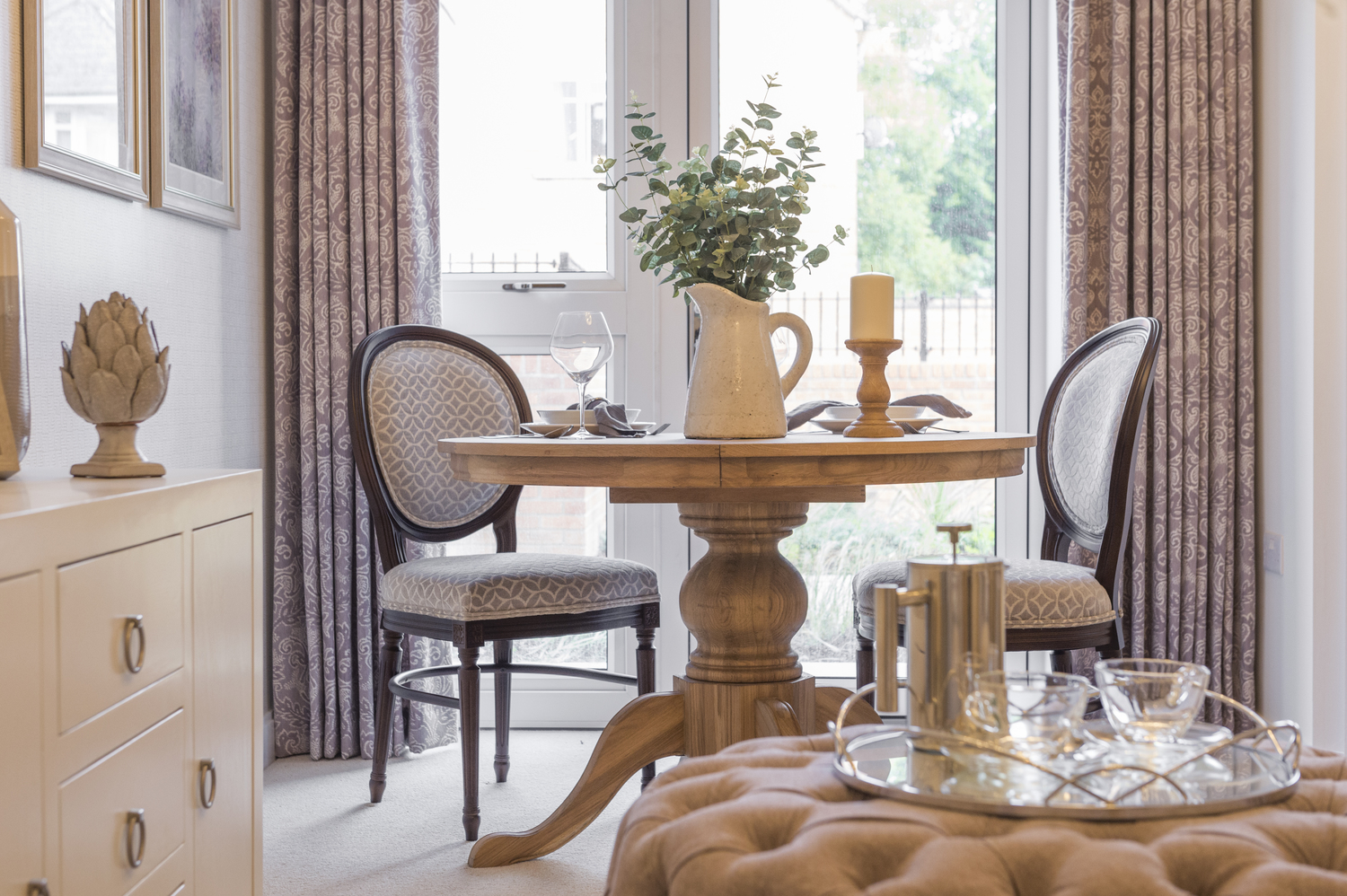a table with a vase and a vase on it