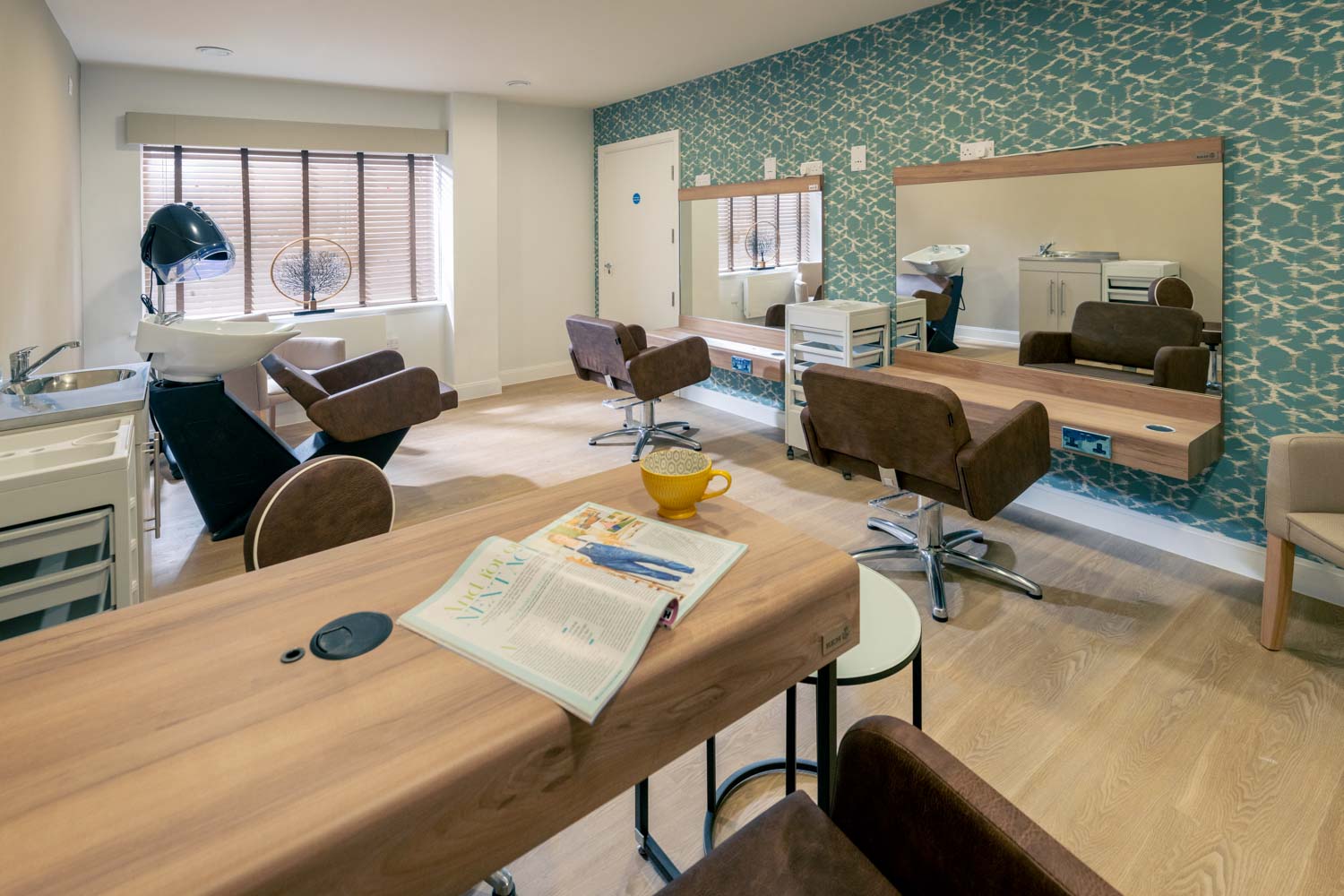 a living room with a table and chairs