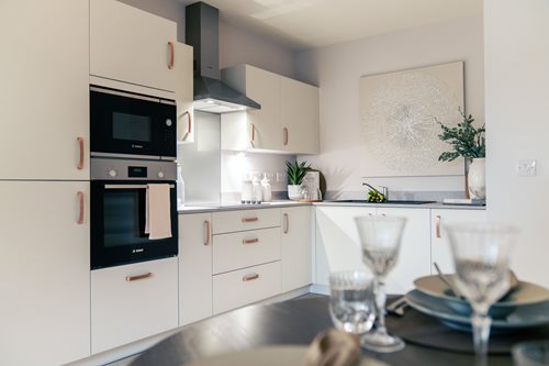 a kitchen with white cabinets