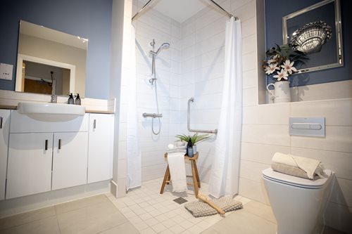 a bathroom with a shower and toilet