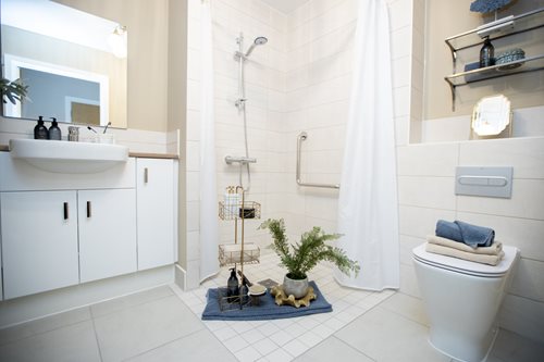 a bathroom with a shower and toilet