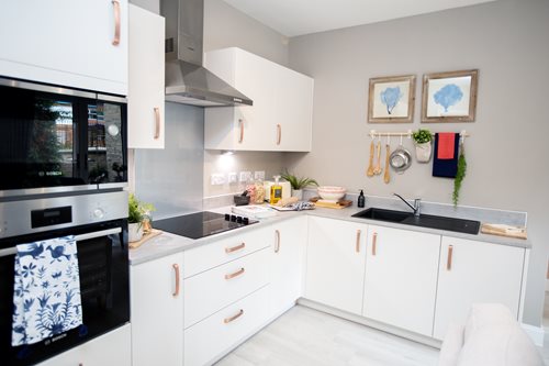 a kitchen with white cabinets