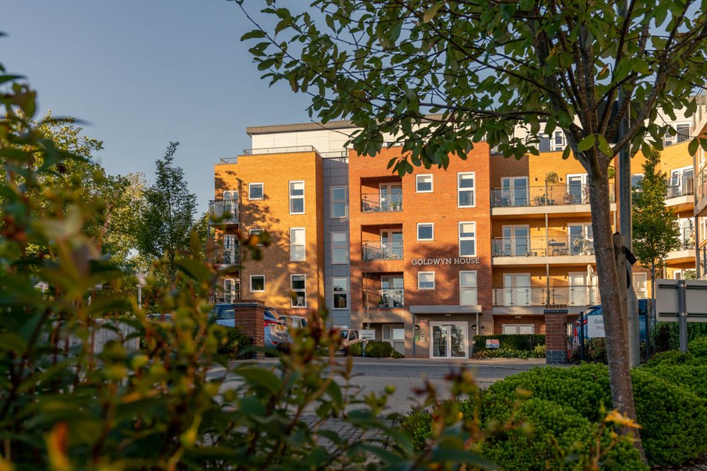 a building with trees in front