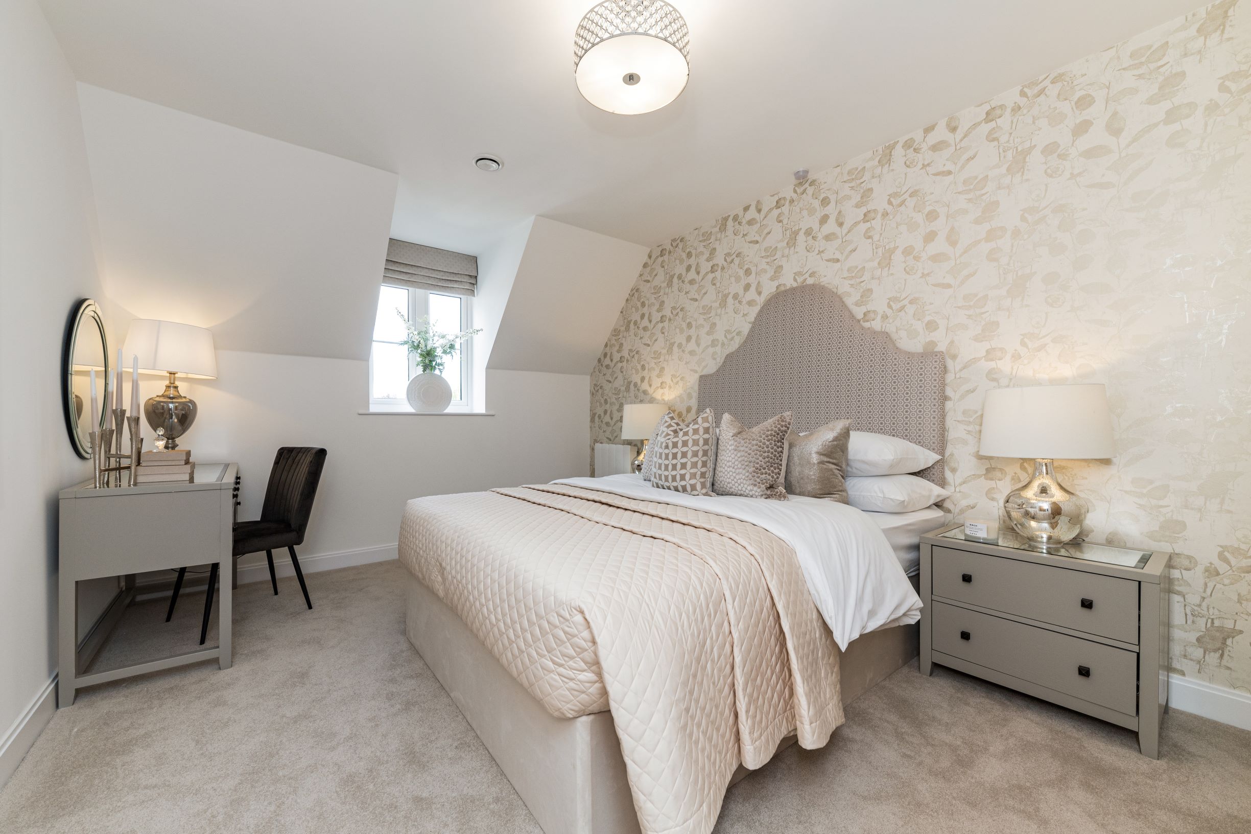 a bedroom with a bed and lamps