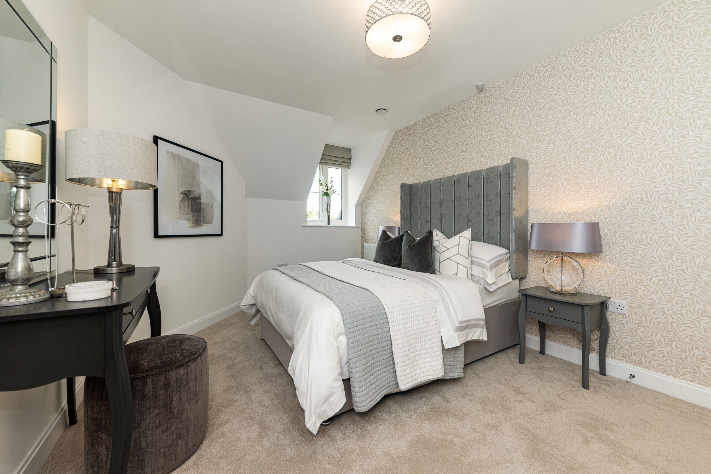 a bedroom with a bed and lamps