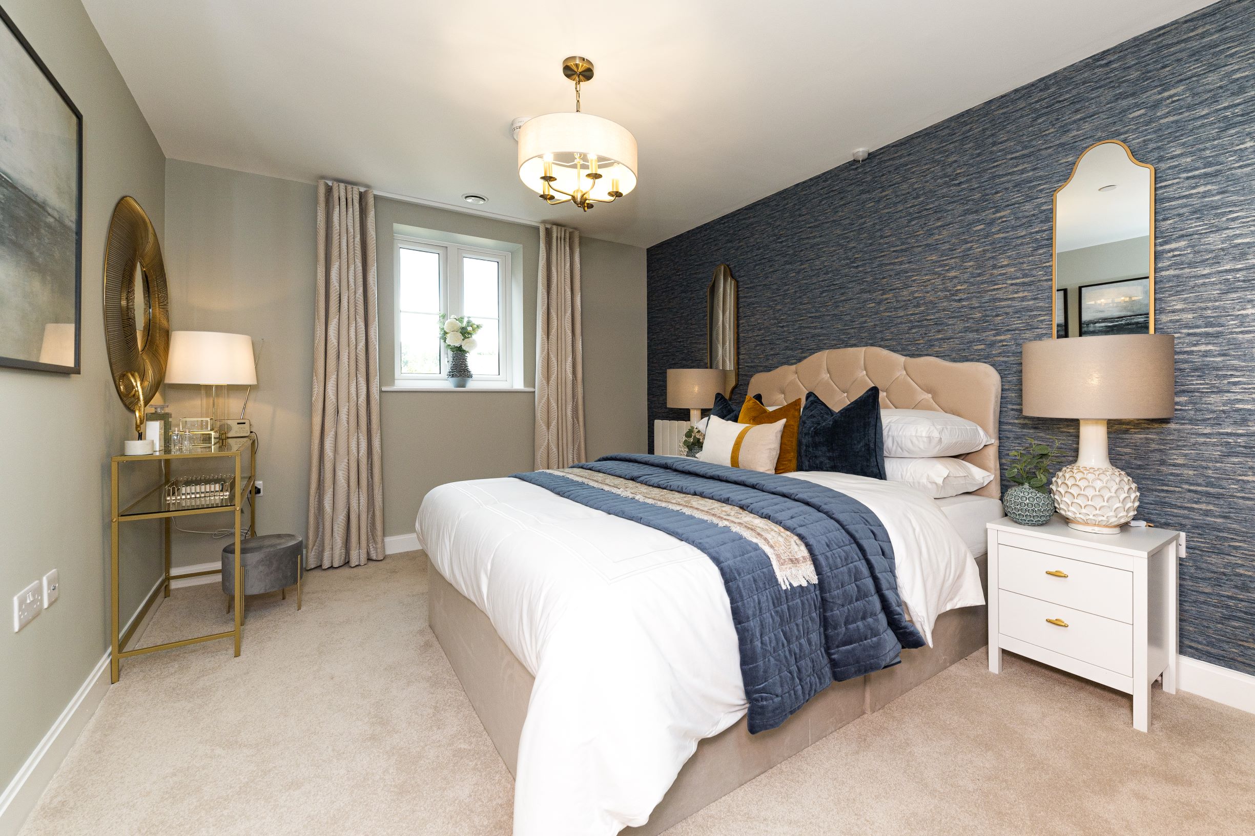 a bedroom with a bed and lamps