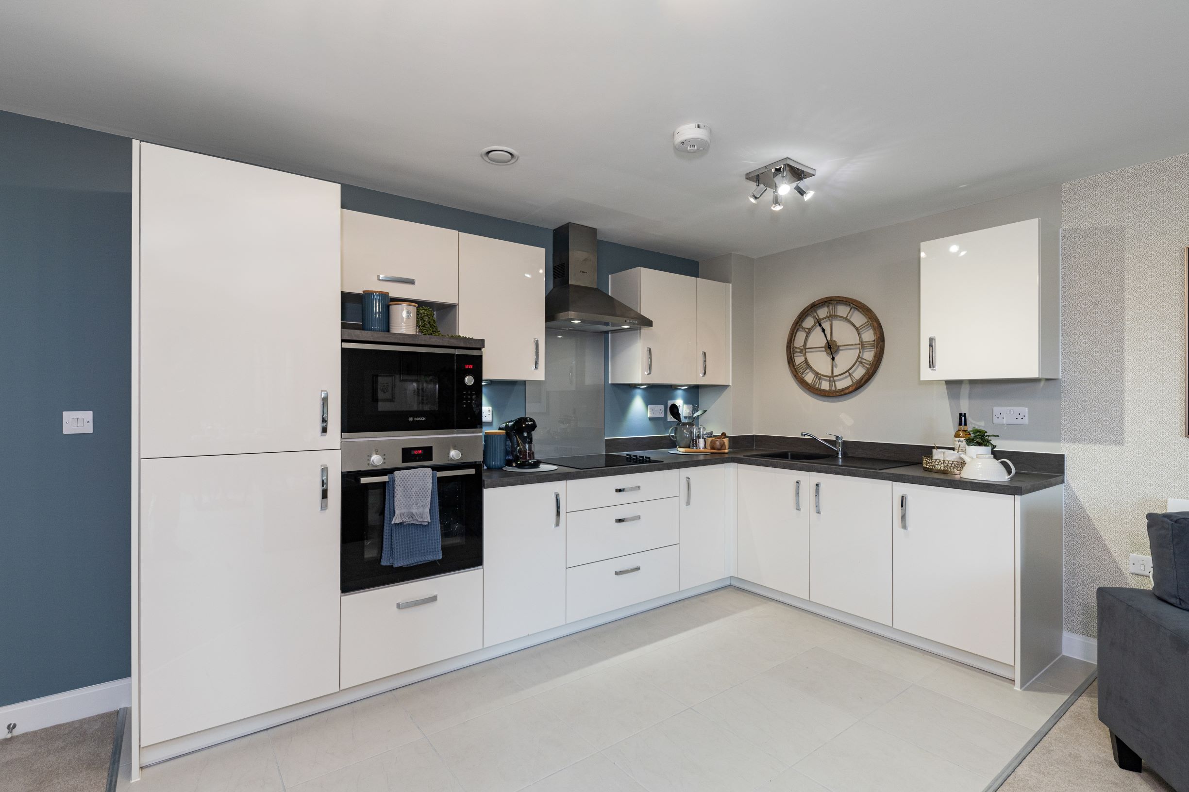 a kitchen with white cabinets
