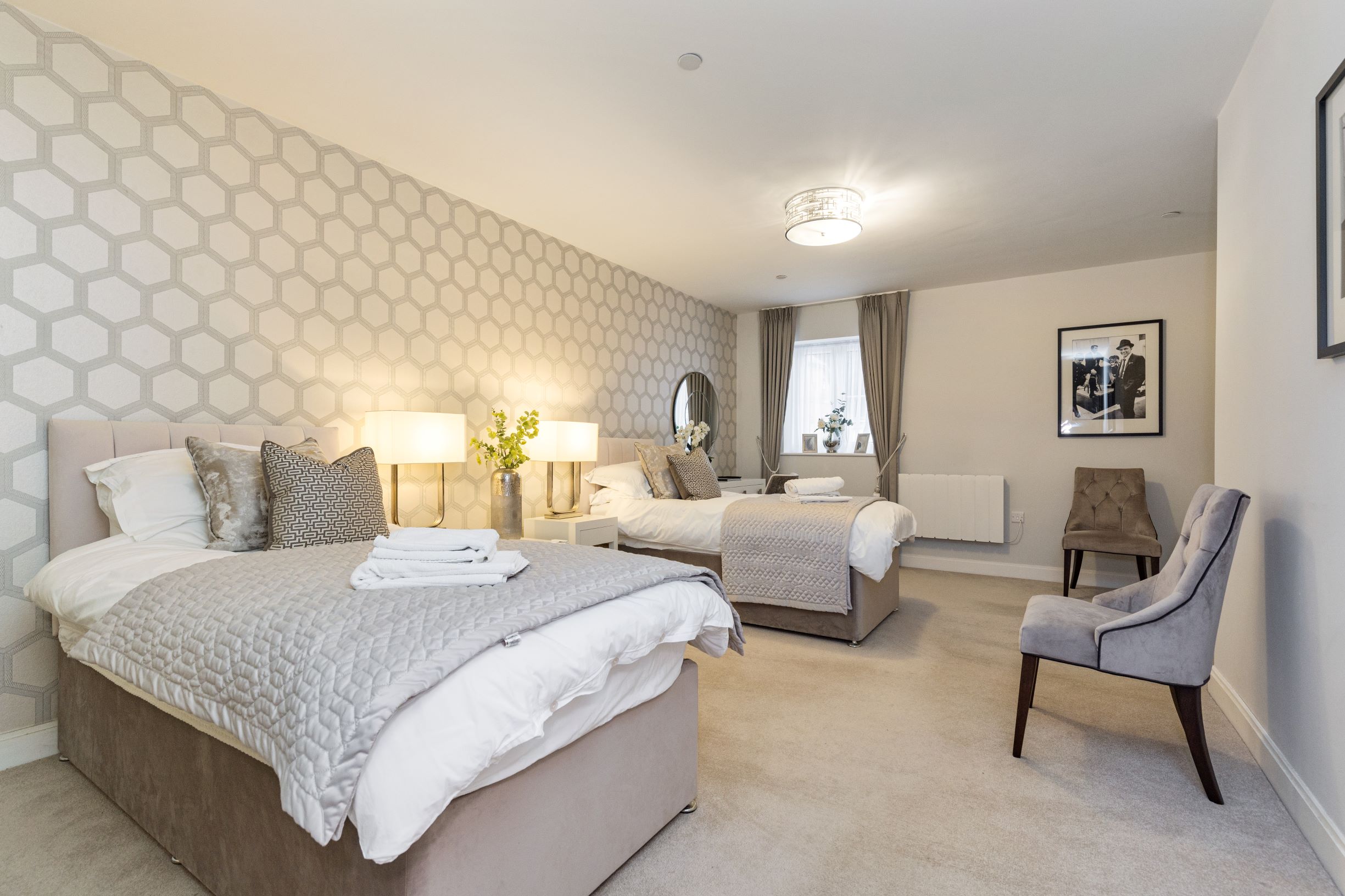 a bedroom with a bed and a chair