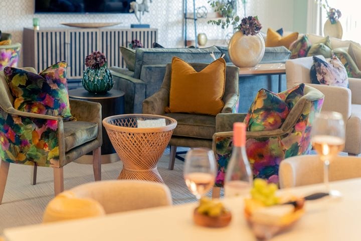 a living room with a couch and a table with candles