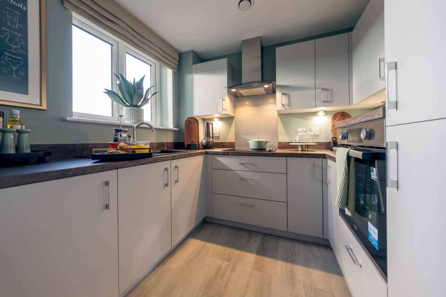 a kitchen with white cabinets