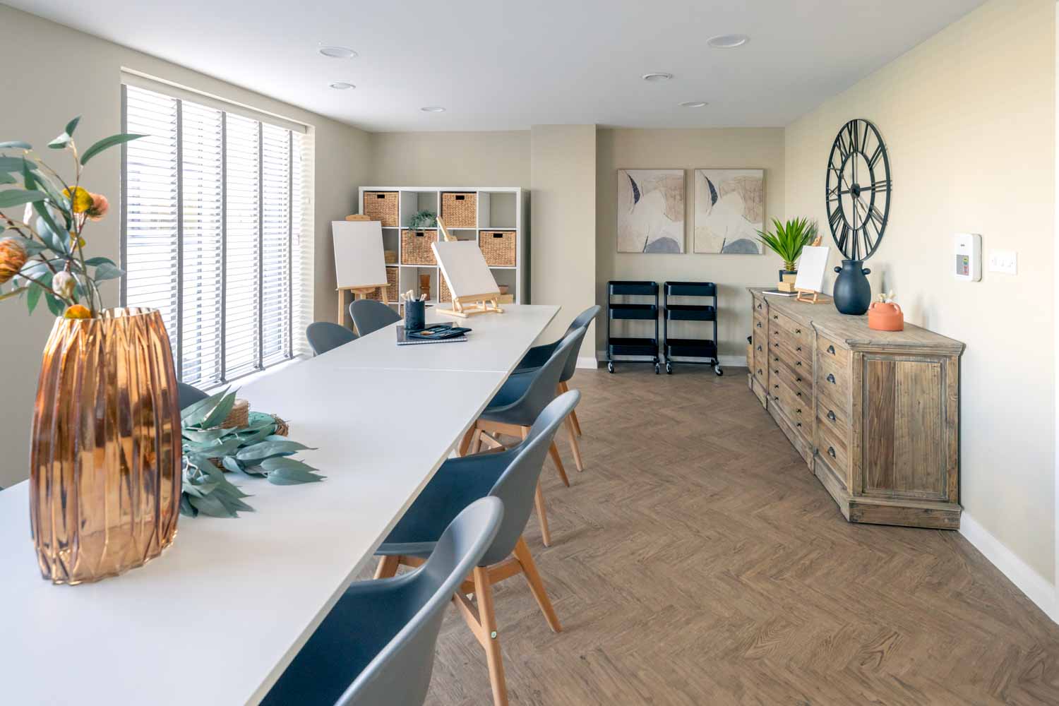 a large room with a table and chairs