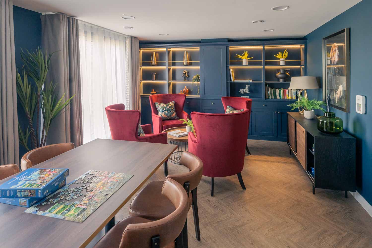 a living room with a table and chairs