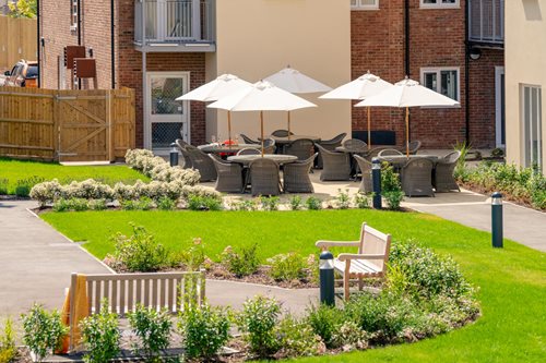 a courtyard with tables and chairs