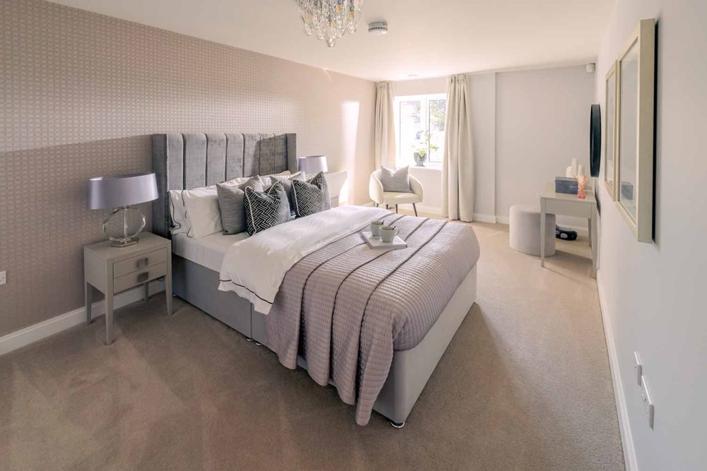 a bedroom with a bed and a chair