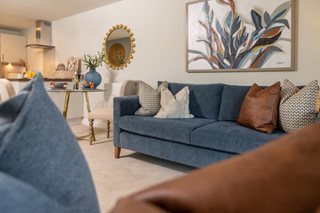 a living room with a couch and a table