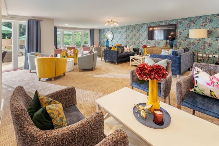 a living room with a large blue wall