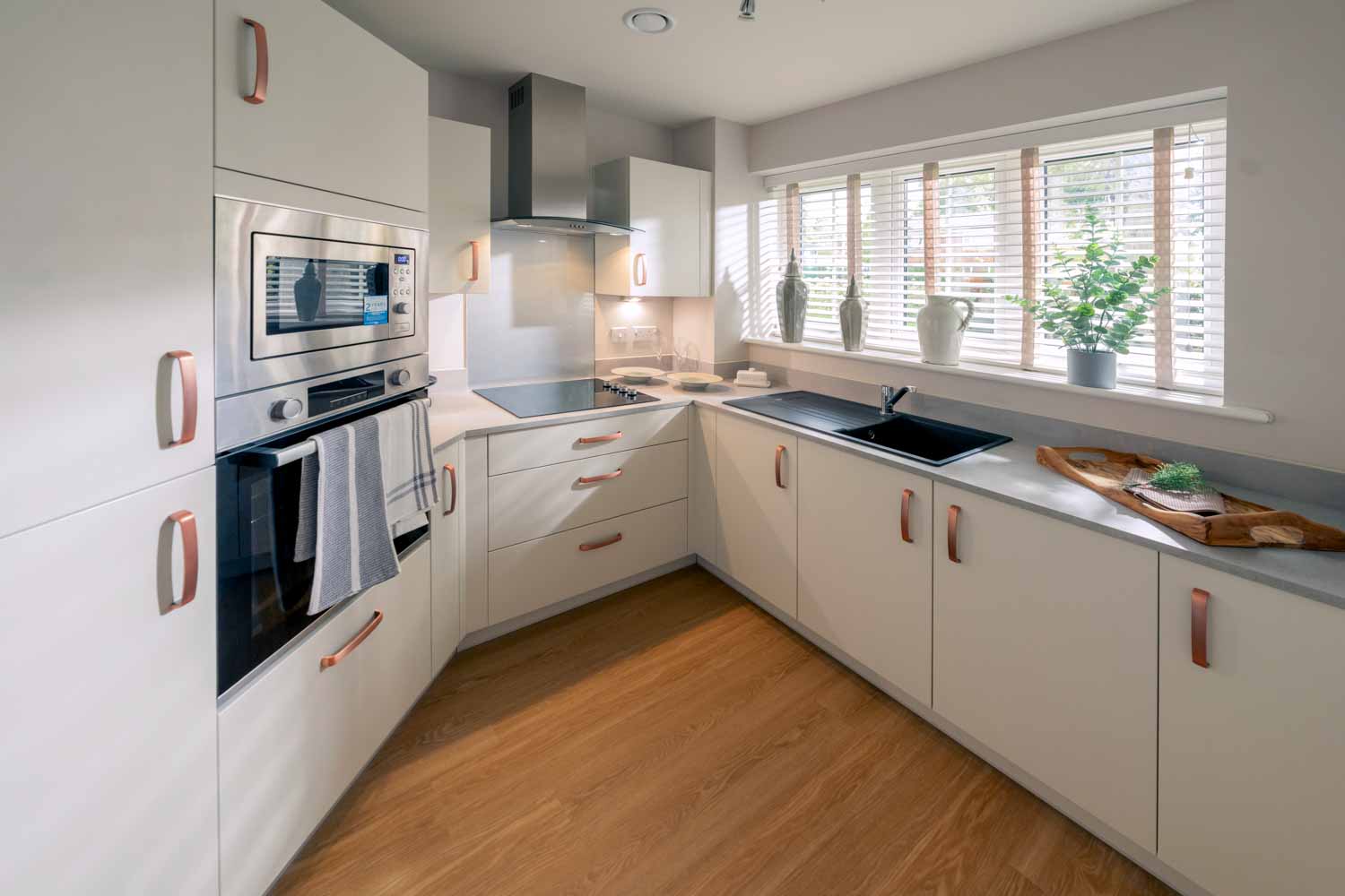 a kitchen with white cabinets