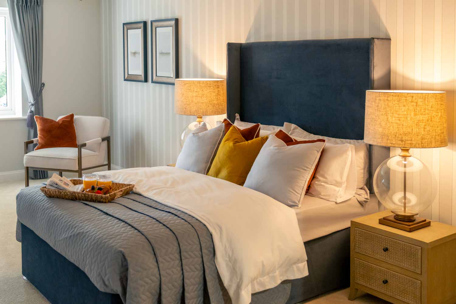 a bed with a blue and white bed spread