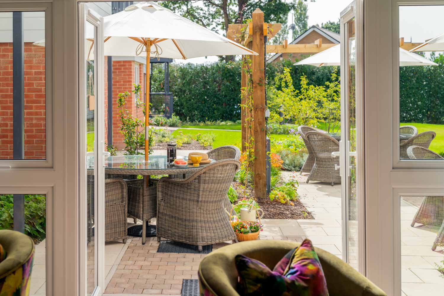 a patio with a table and chairs
