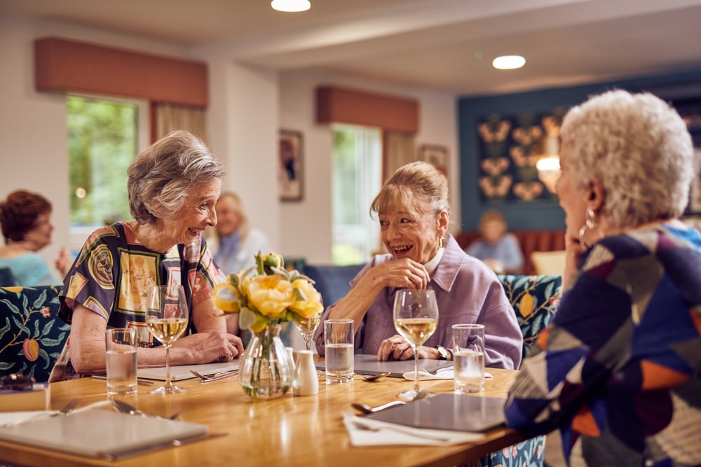 friends-enjoying-lunch-in-the-restaurant-at-mccarthy-stone-retirement-development-rentals