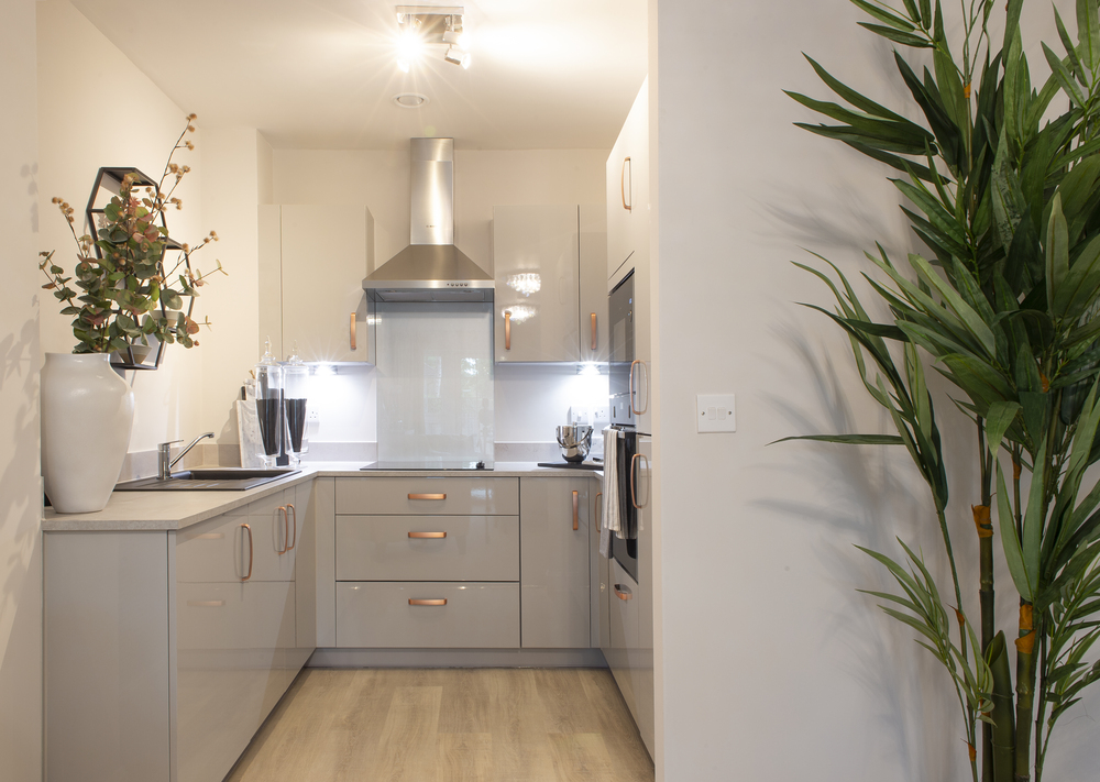 a kitchen with white cabinets