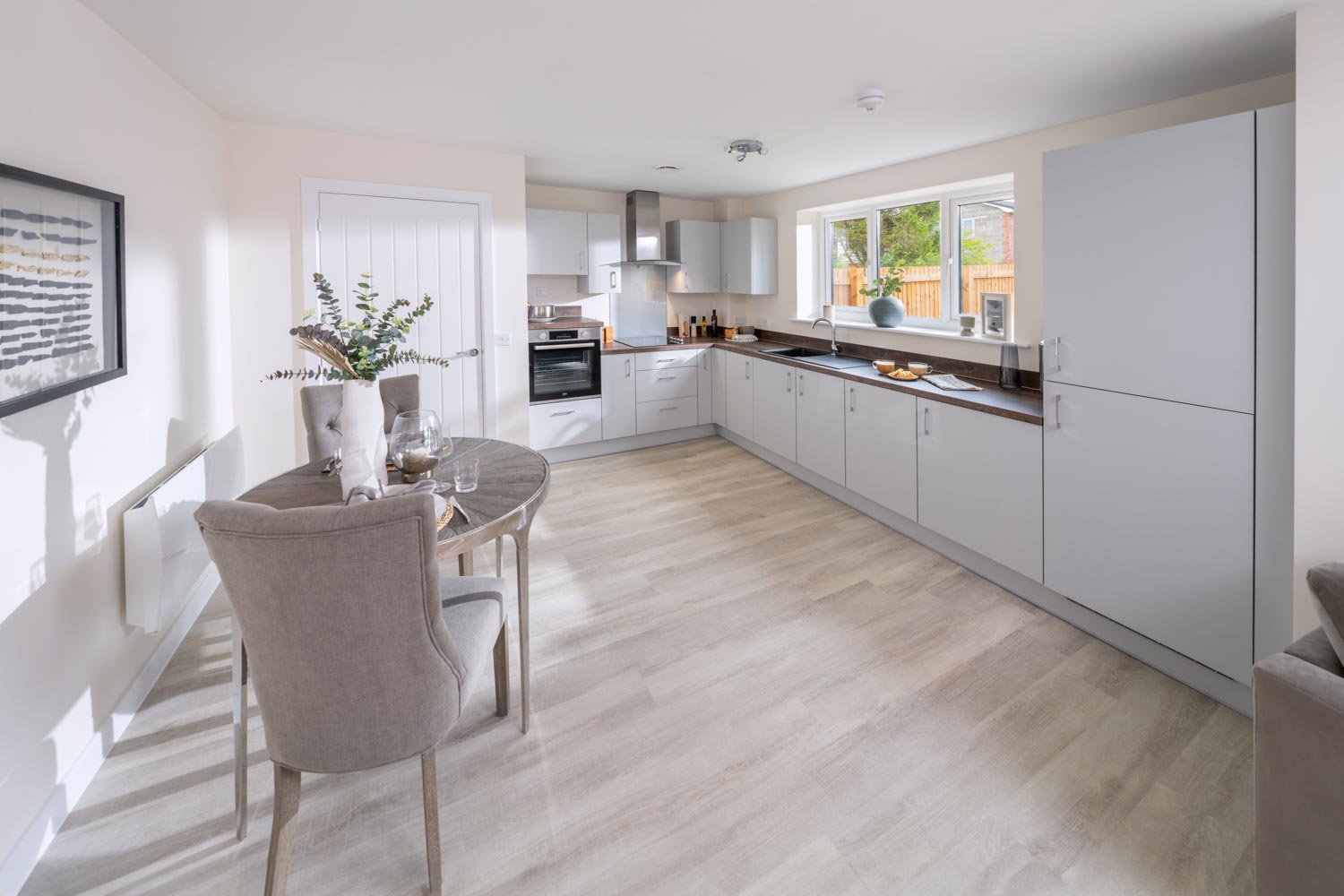 a kitchen with white cabinets