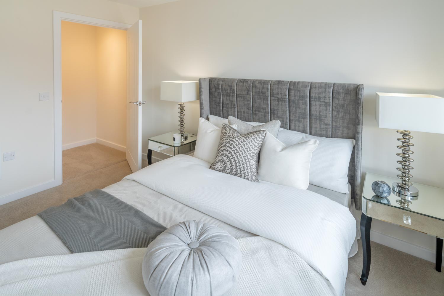 a bed with white pillows