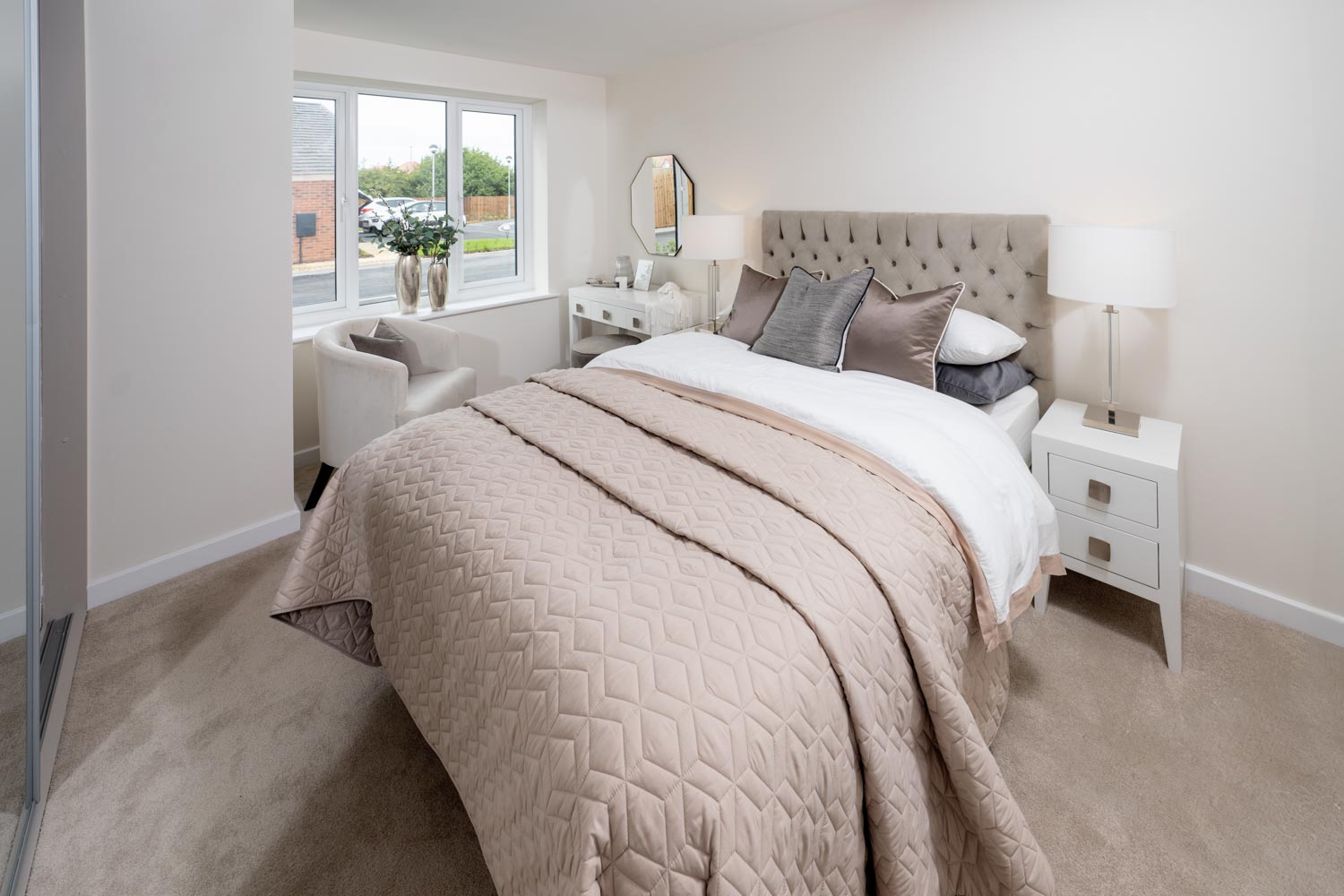 a bedroom with a bed and a chair