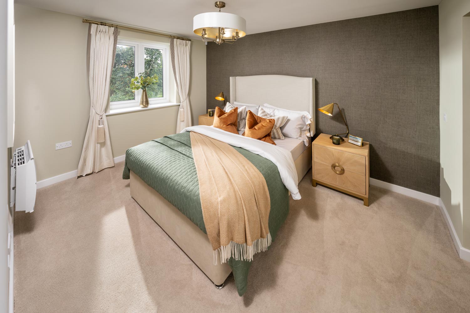 a bedroom with a bed and a lamp