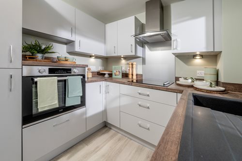 a kitchen with white cabinets