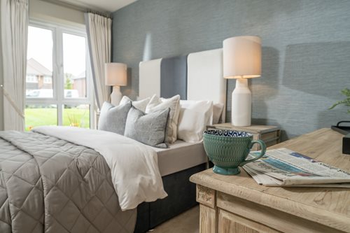 a bedroom with a bed and a coffee table