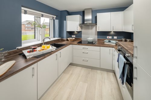 a kitchen with white cabinets