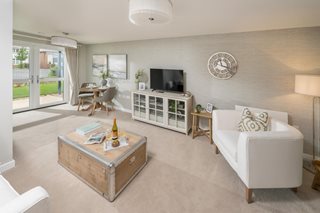 a living room with a tv and couches