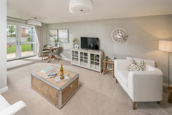 a living room with a tv and couches