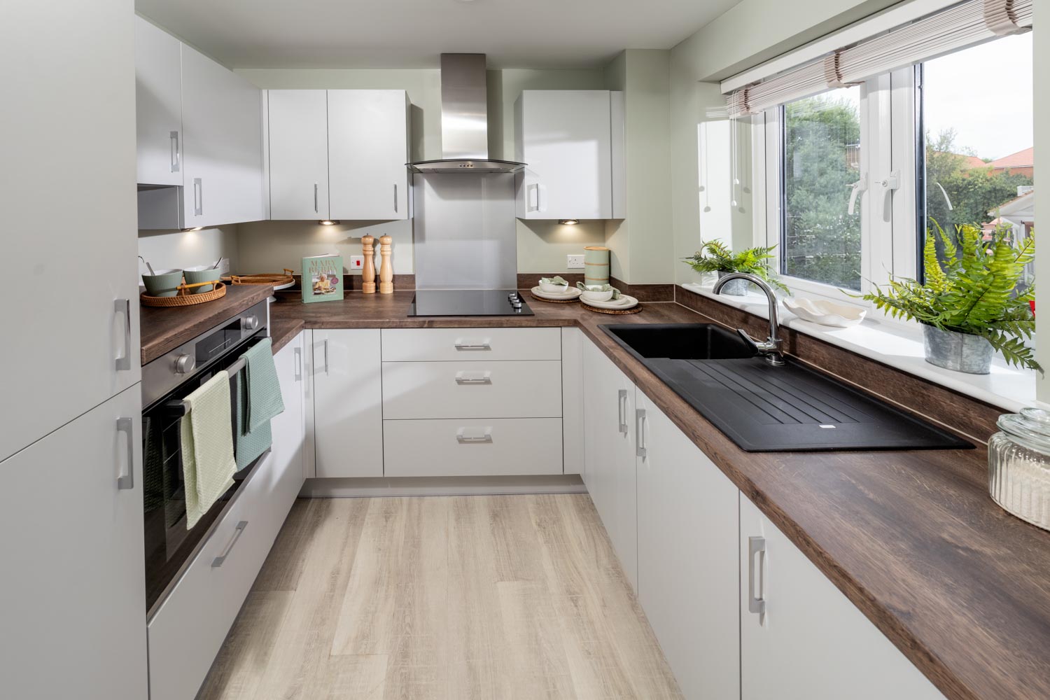 a kitchen with white cabinets