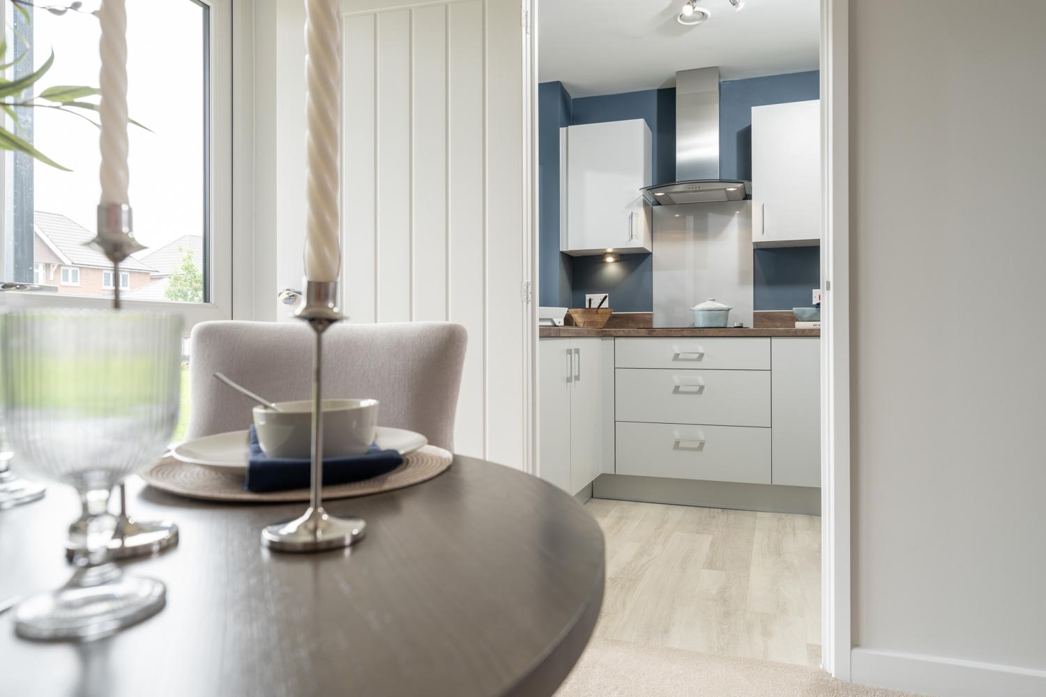 a kitchen with a table and chairs