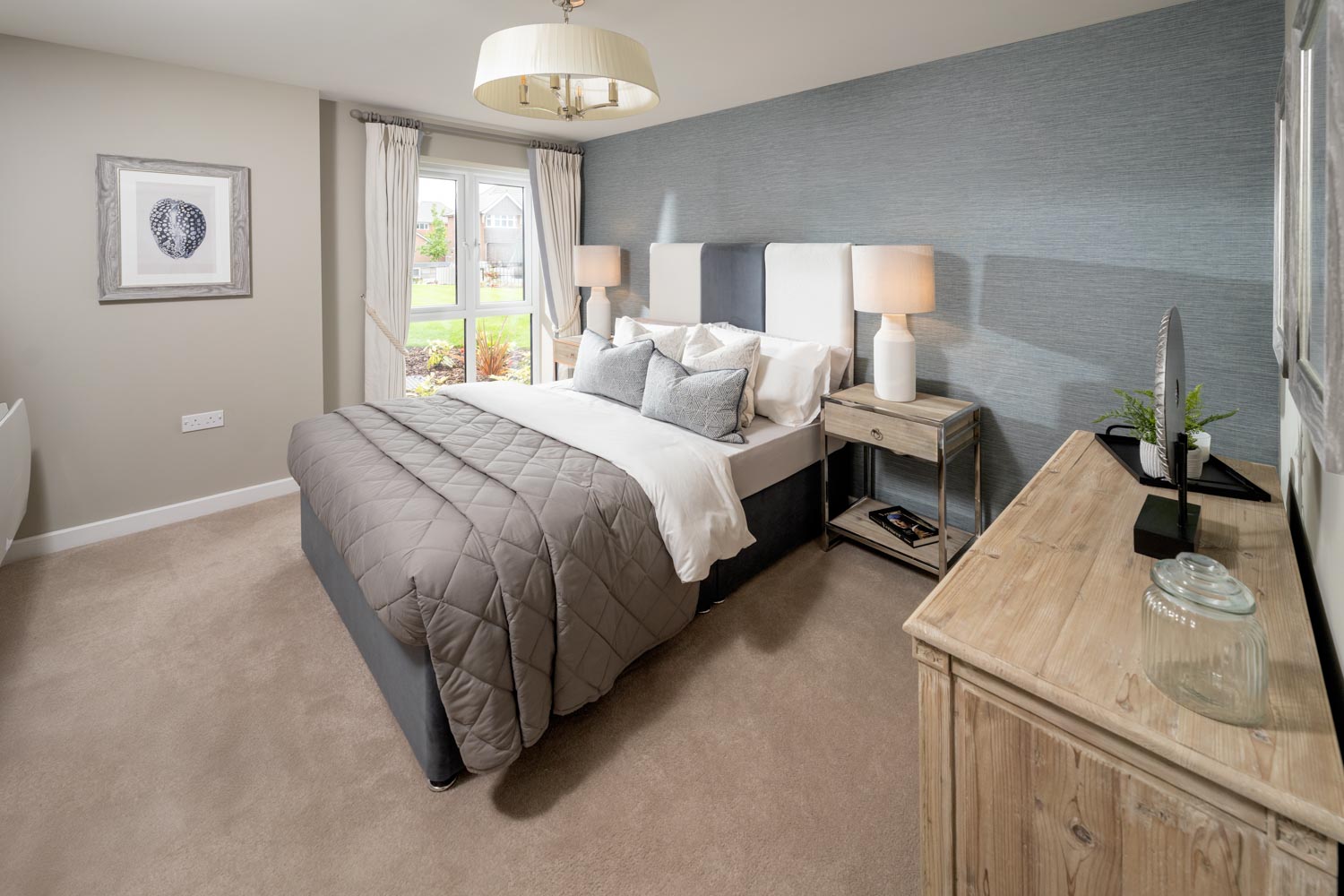 a bedroom with a bed and a table