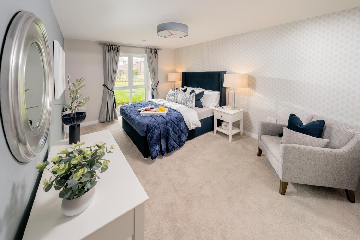 a bedroom with a bed and couches