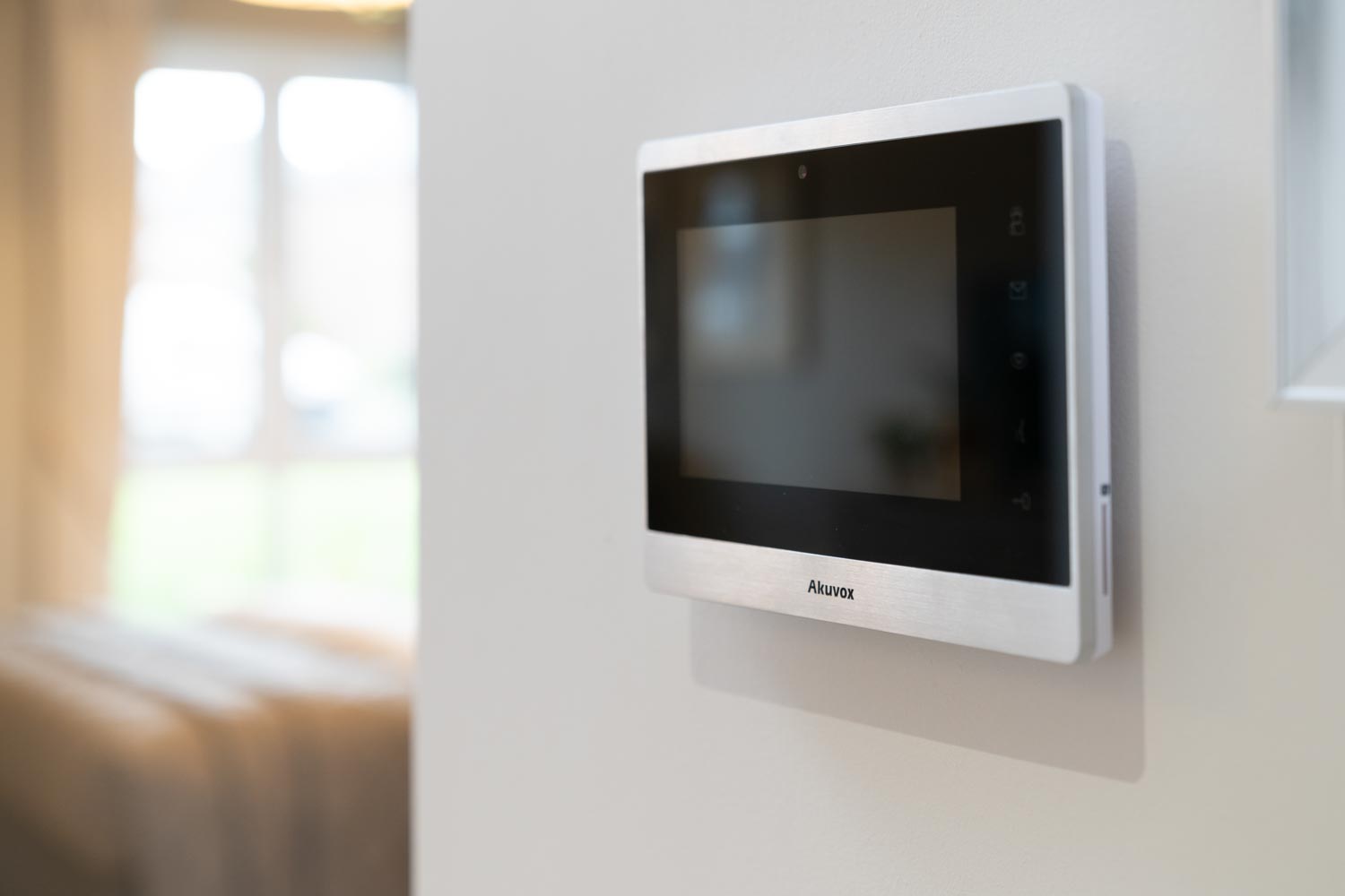 a white rectangular device on a white wall