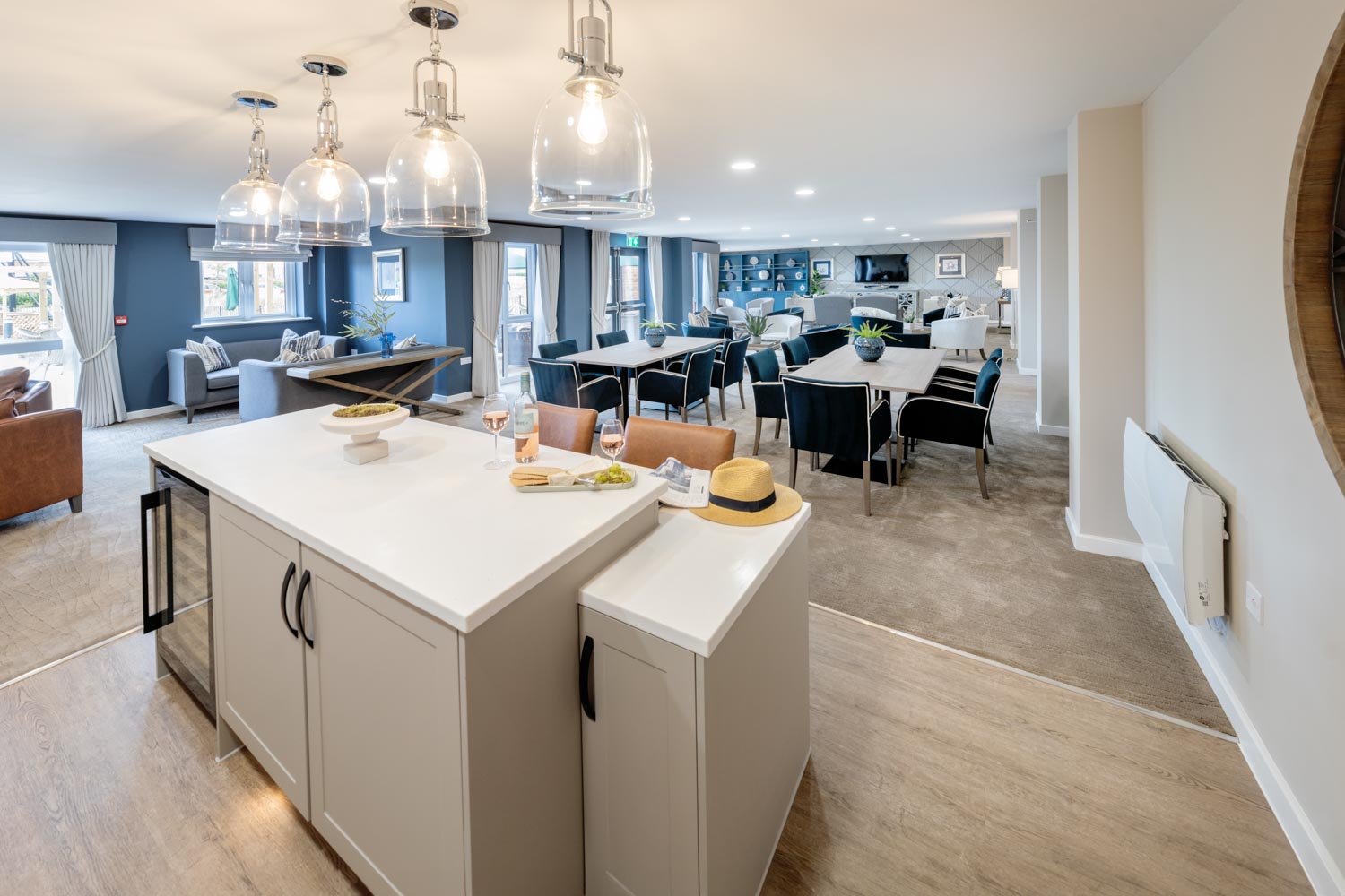 a kitchen with a bar and dining area