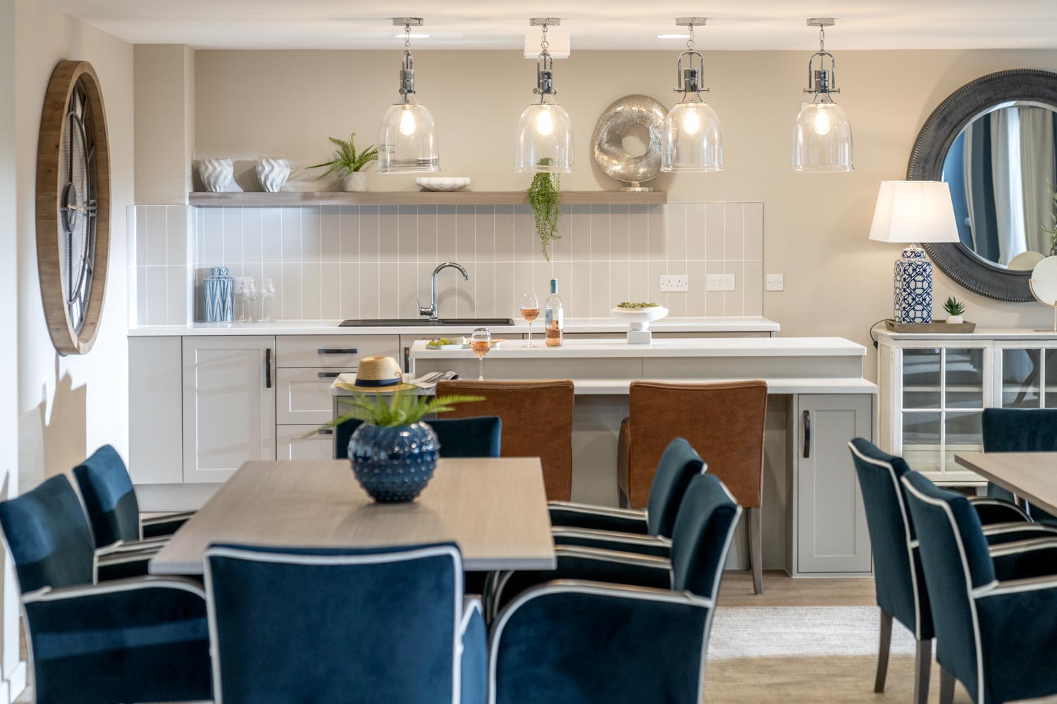 a kitchen with a dining table and chairs
