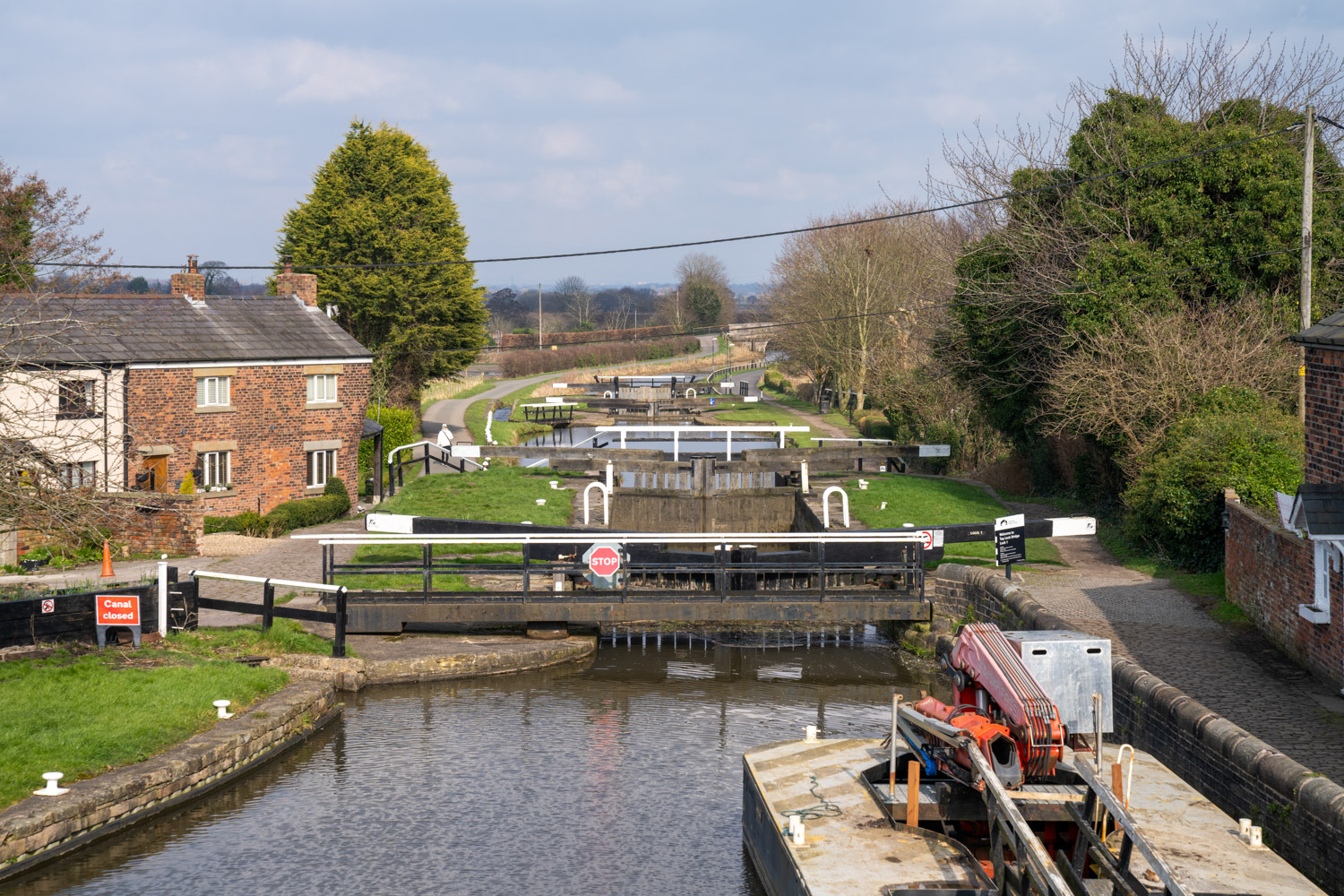 a boat is parked on the side of a river