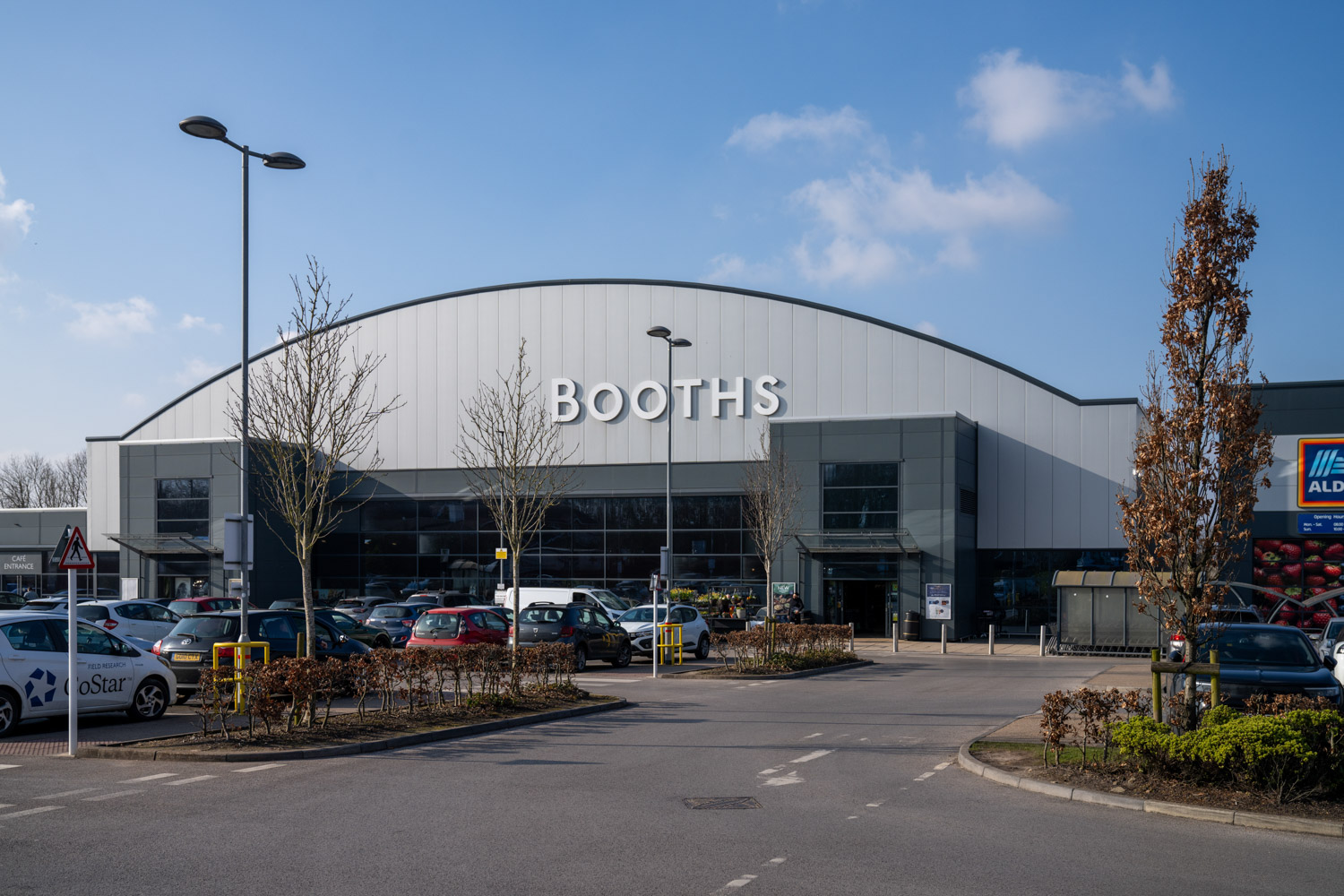 a building with cars parked in front